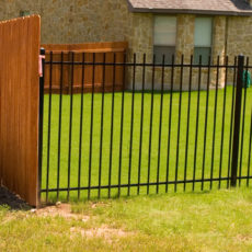 black iron fence with masonary