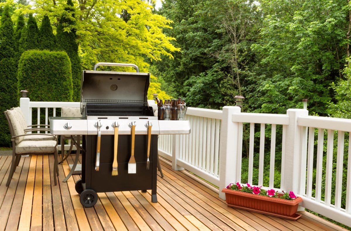 Grilling On A Wooden Deck - Austex Fence & Deck