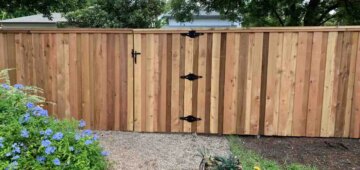 Six foot board on board fence with cap and trim using post masters