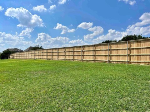 Eight foot privacy wood fence with four rails