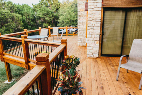Custom cedar deck with Cedar posts and iron railing