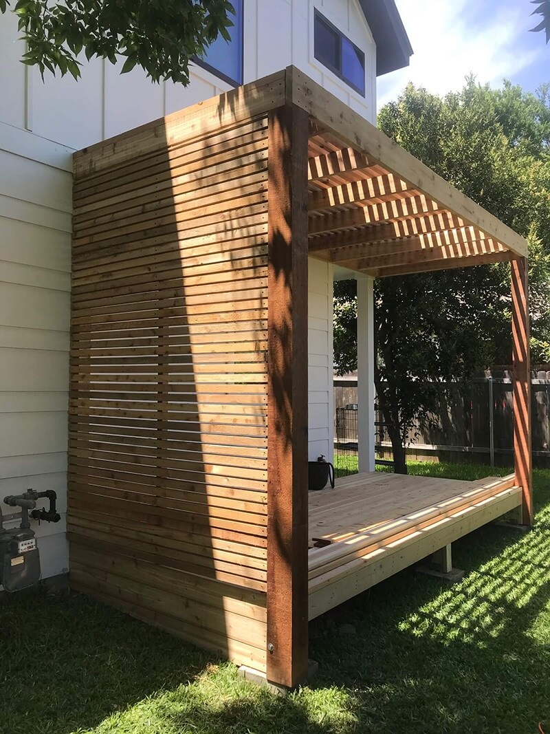 Cedar deck with shade arbor and custom privacy screen with 2x2s