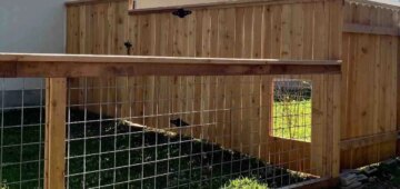 six foot horizontal fence with cap and trim with pet gate