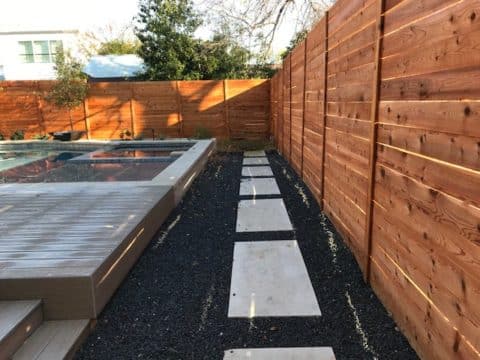 Six foot horizontal privacy wood fence around pool