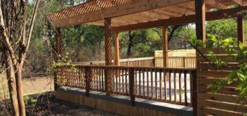 Large composite deck with wooden pergola for shading