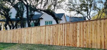 Six foot board on board privacy fence with cap and trim