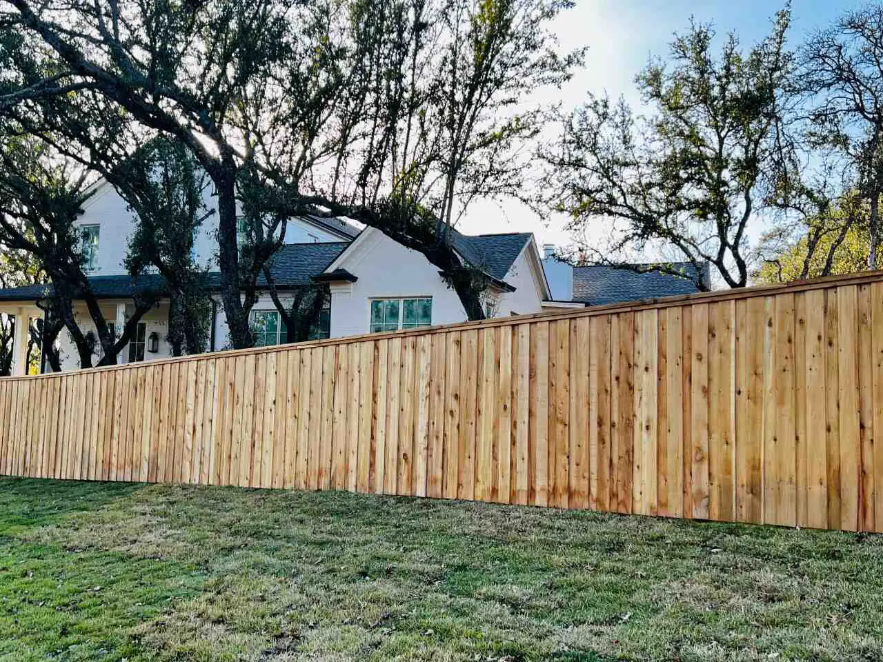 Six foot board on board privacy fence with cap and trim