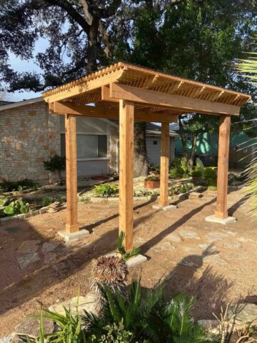 Backyard wooden pergola protecting from the sun