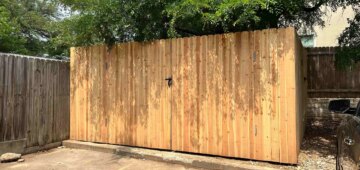 eight foot privacy fence around commercial dumpstert