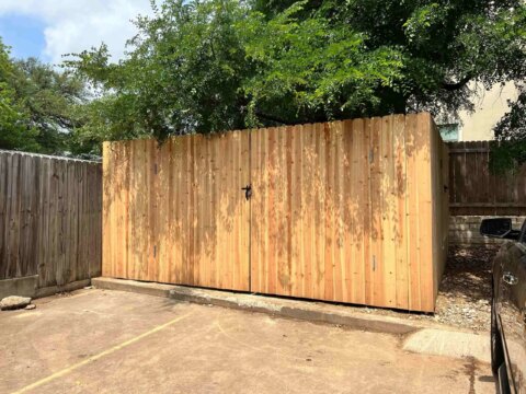 eight foot privacy fence around commercial dumpstert
