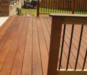 backyard-wood-deck-with-wood-and-iron-fence