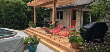 Deck with pergola and subtle landscaping