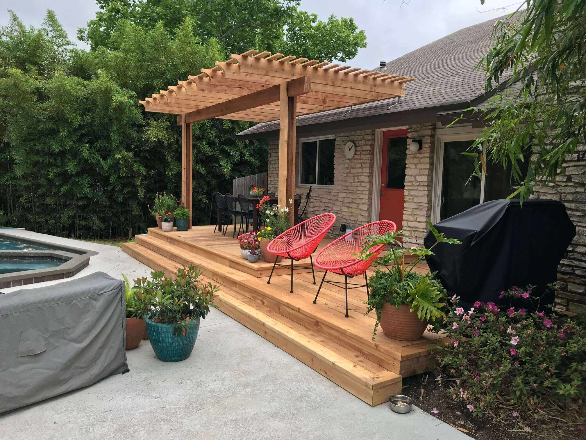 Deck with pergola and subtle landscaping