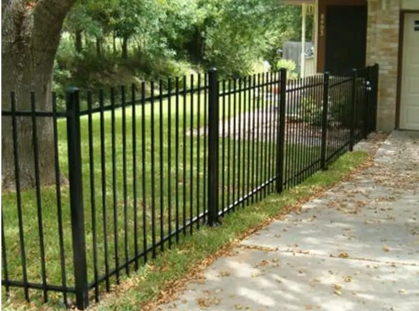 Ornamental iron fence on a sloped Austin front yard