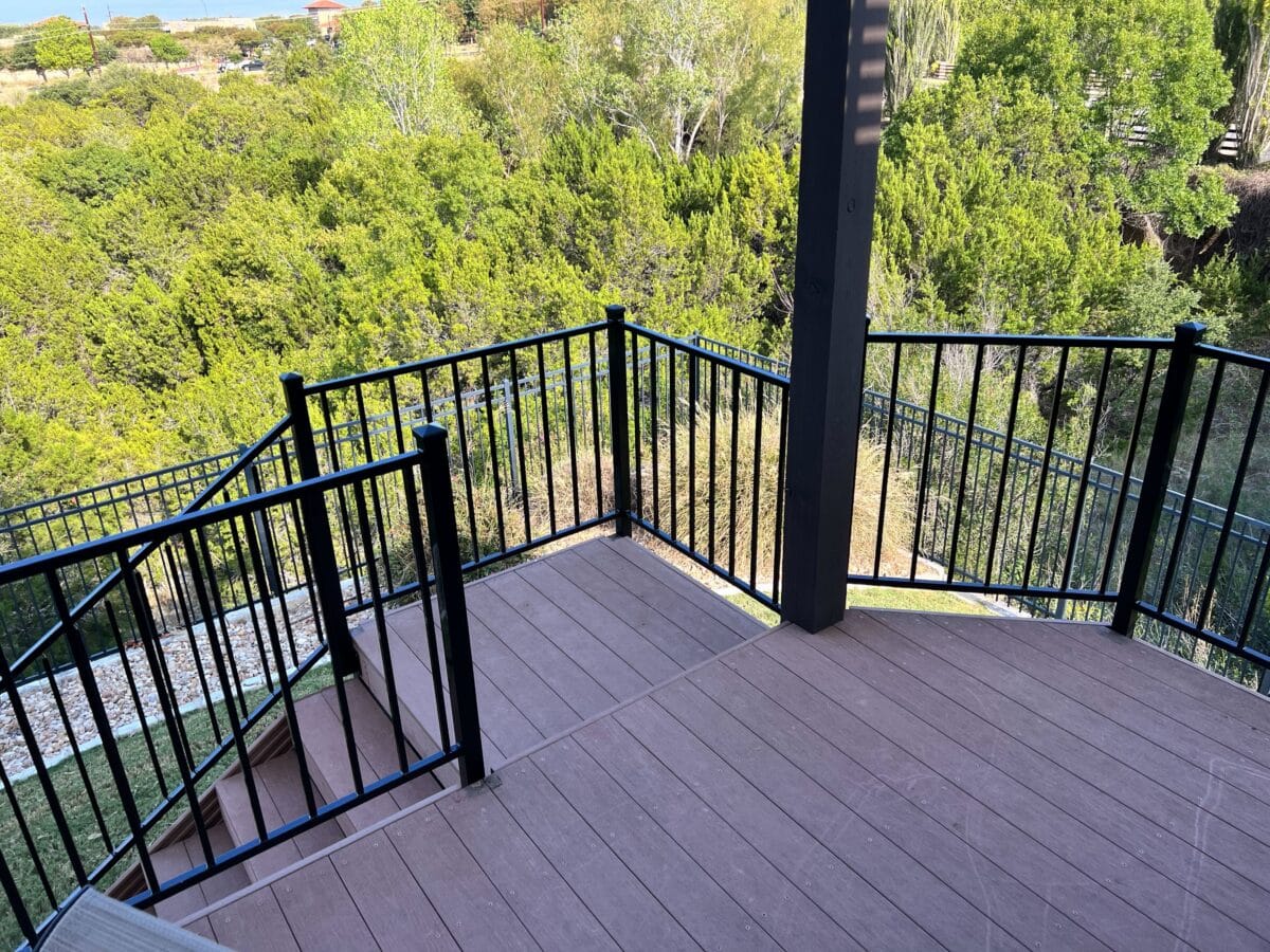 New iron railing on a raised wood deck and stairs