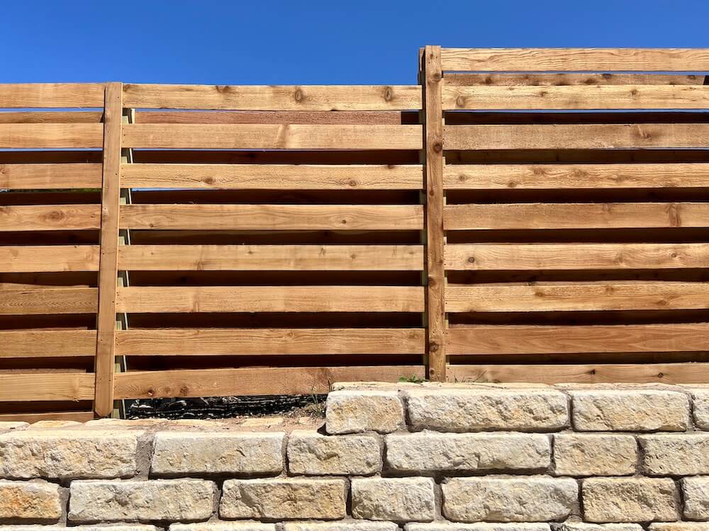 Horizontal shadowbox wood fence by Austex