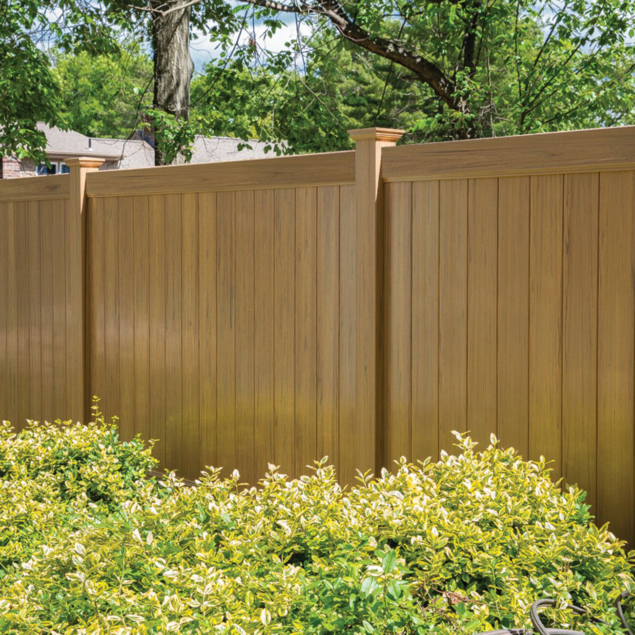 Brown vinyl fence in an Austin backyard