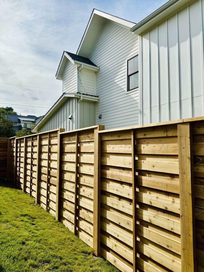 Shadow box style wooden fence.