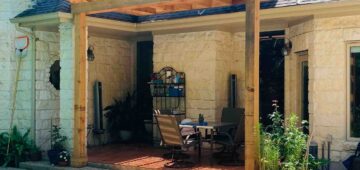 Wooden pergola covering deck by the pool