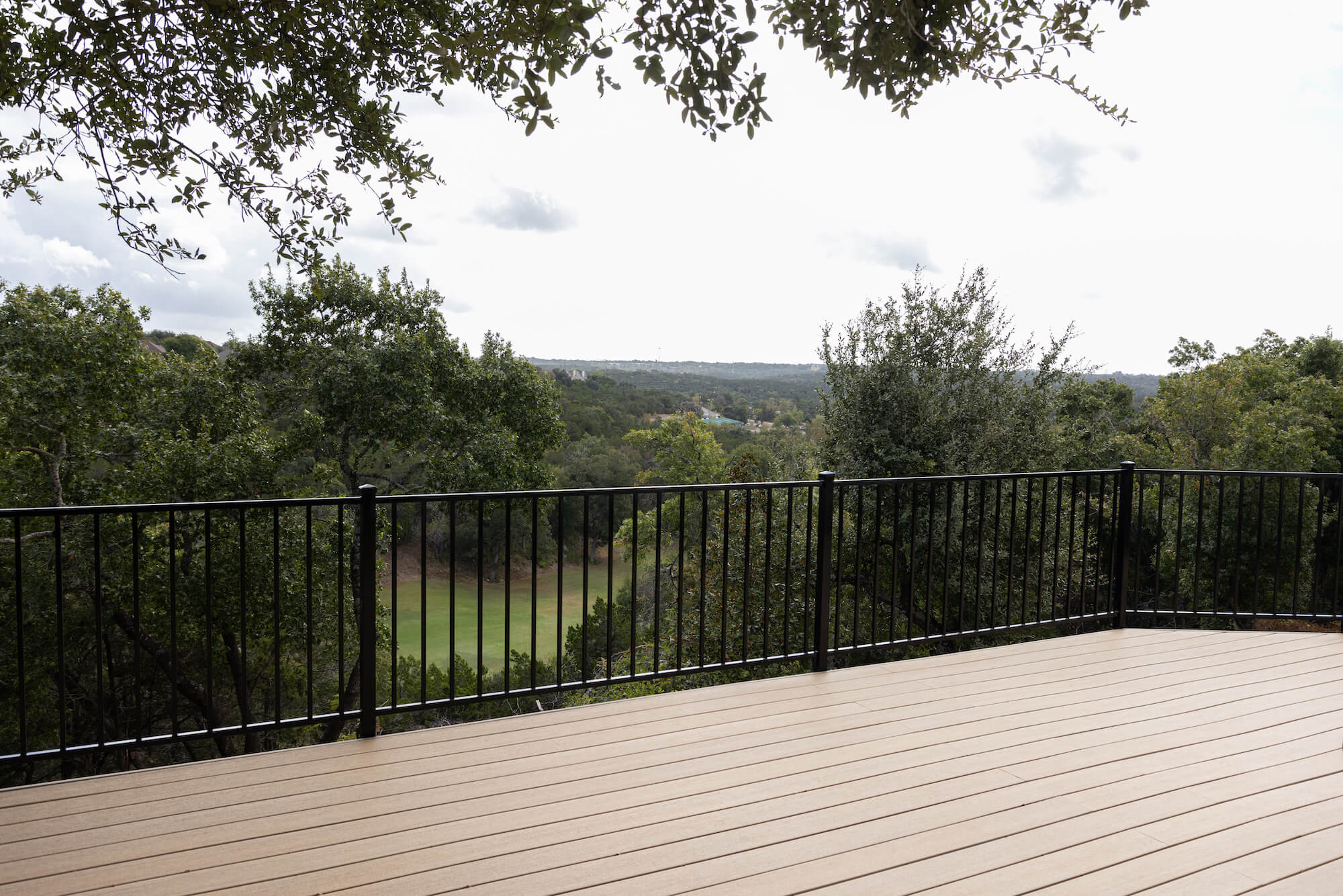Composite deck with iron railing